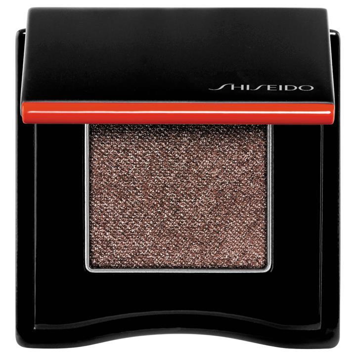 Shiseido Pop Eyeshadow in shade 08 features a sleek black compact with a vibrant red stripe, containing a shimmering, rich brown eyeshadow.