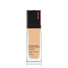 Shiseido Synchro Skin Radiant Lifting Foundation in Nude, featuring a sleek glass bottle with a black cap and a pump dispenser for easy application.