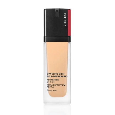 Shiseido Synchro Skin Self Refreshing Foundation in a clear glass bottle with a black and red cap, featuring a beige liquid and labeled with SPF 30 and oil-free details.