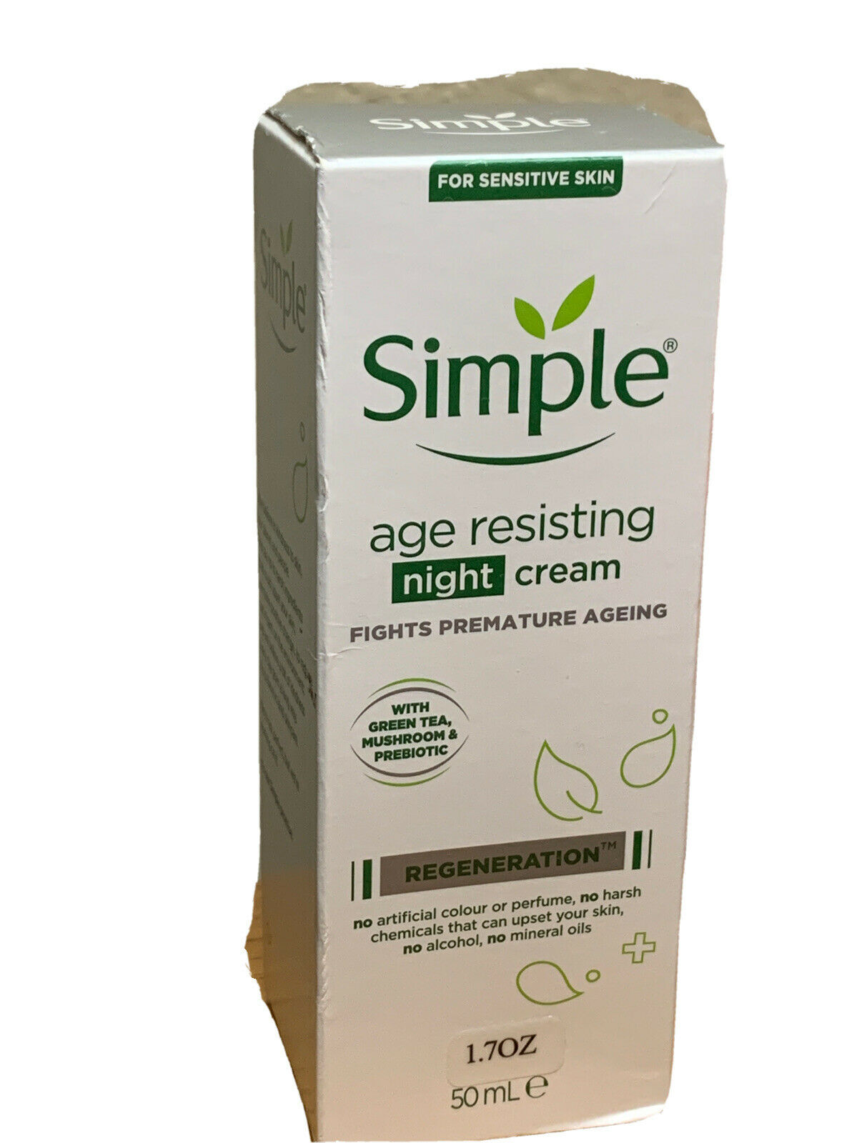White box with green accents featuring "Simple" logo, labeled "Age Resisting Night Cream," highlights benefits for sensitive skin, contains 50ml, and mentions green tea and prebiotic ingredients.