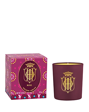 A luxurious burgundy candle with a gold emblem, accompanied by a vibrant pink box featuring intricate floral patterns, labeled "Rose" and weighing 140g.