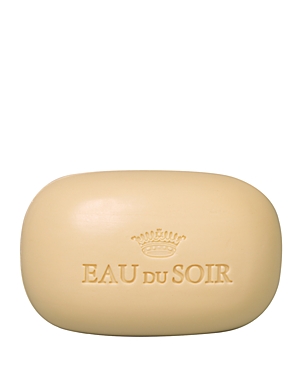 Cream-colored, oval-shaped soap with "EAU DU SOIR" embossed on the surface, featuring a decorative crown logo above the text.