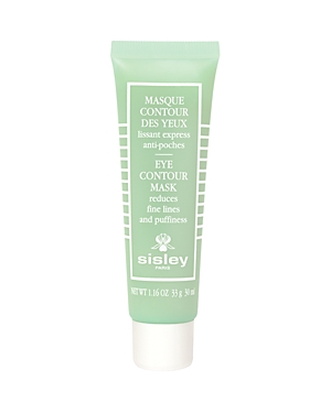 Light green tube of Sisley Paris Eye Contour Mask with white text, designed to reduce fine lines and puffiness, featuring a flip-top cap and sleek, minimalist design.