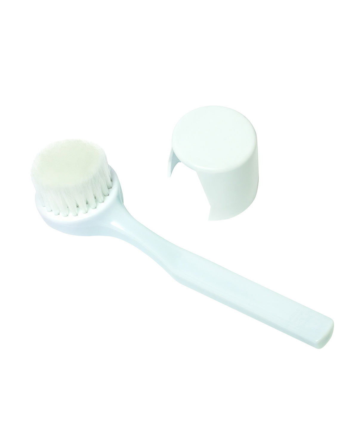 Gentle brush with a white plastic handle and soft, white bristles, accompanied by a matching protective cap.