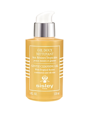 Transparent bottle with a yellow tint, featuring a pump dispenser, labeled "Gentle Cleansing Gel" by Sisley, highlighting tropical resins for combination and oily skin.