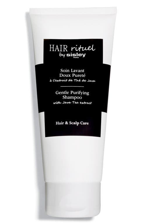 White tube of Sisley-Paris Hair Rituel Gentle Purifying Shampoo with a black label, featuring text in white and black, highlighting its hair and scalp care benefits.