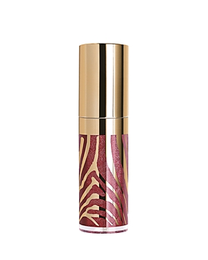 Sisley Le Phyto-gloss in #4 Twilight features a sleek gold cap with a zebra-striped pink and gold base, showcasing a shimmering, deep pink lip gloss.