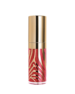 Glossy lip gloss in a sleek gold and pink zebra-striped tube, featuring a shiny gold cap and vibrant pink shade with sparkling shimmer.