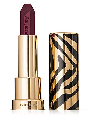 Deep burgundy lipstick in a sleek, gold and black zebra-striped case, featuring the Sisley logo on the base, showcasing an elegant and luxurious design.