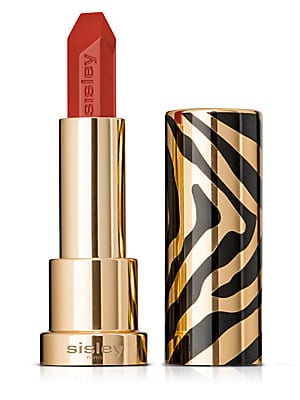Sisley Le Phyto Rouge Lipstick in vibrant orange shade, housed in a gold tube with a striking black and gold zebra print design.