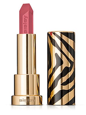 A pink lipstick bullet in a sleek gold and black zebra-striped case, featuring a modern design with the brand name "Sisley" embossed on the base.