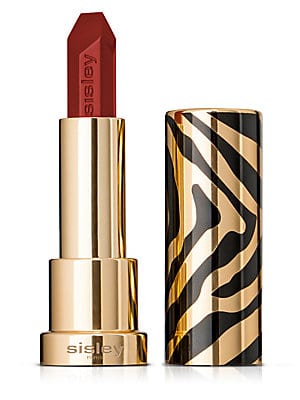 Red lipstick in a sleek, gold tube with a black and gold zebra-striped design, featuring a pointed tip for precise application.