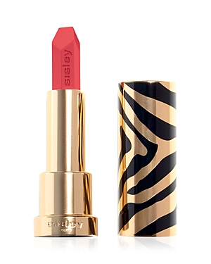 Bright coral lipstick in a sleek gold and black zebra-patterned case, showcasing a bold, angular bullet design.