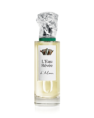 Clear glass bottle with a rectangular shape, featuring a silver and green cap, labeled "L'Eau Rêvée d'Alma" in elegant font, containing a light yellow fragrance.
