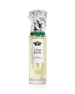 Clear glass perfume bottle with a silver and green cap, featuring a textured, crumpled design; label reads "L'Eau Rêvée d'Alma" in elegant font.