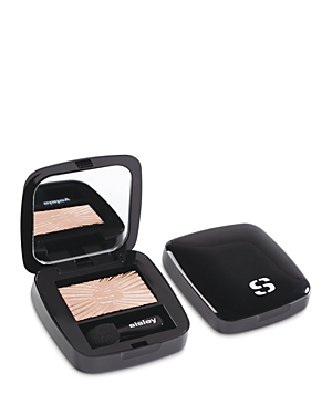 Black compact featuring a mirror and a light beige eyeshadow with a textured surface, labeled "Sisley" on the inside and "S" on the top.