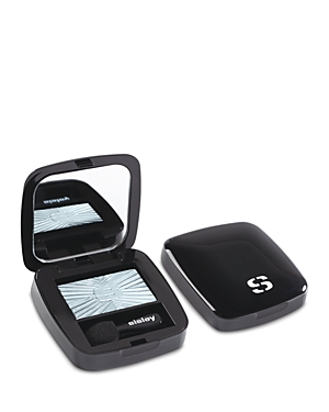 Long-lasting luminous eyeshadow in a sleek black compact, featuring a light blue shade labeled "30 Silky Sky," with a mirror and applicator included.