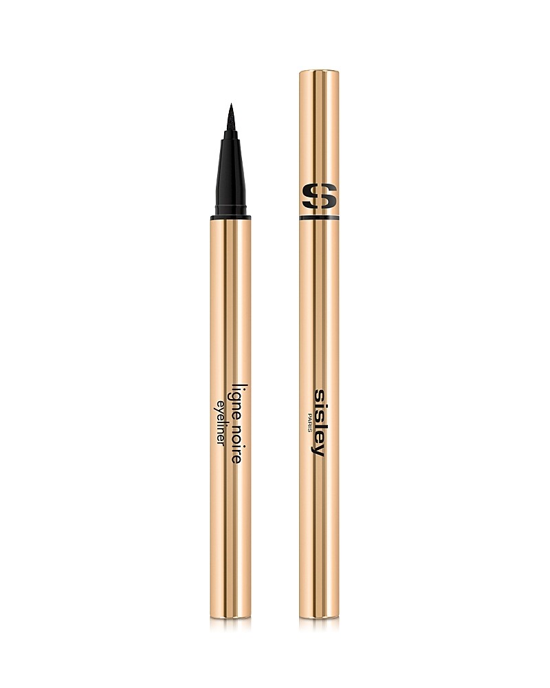 Black liquid eyeliner in a sleek gold tube, featuring a fine tip applicator for precise application, labeled "Ligne Noire" and "Sisley" in elegant font.