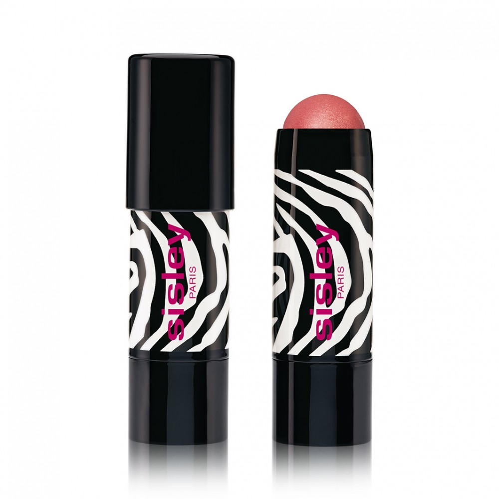 Sisley Phyto Blush Twist in #5 Contour features a sleek black and white zebra-striped tube with a vibrant pink logo, showcasing a creamy blush stick in a soft rosy hue.