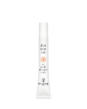 White tube with a pointed applicator, labeled "Phyto-Cernes Éclat Eye Concealer" in black and peach text, featuring botanical extracts, with a soft peach shade visible on the label.