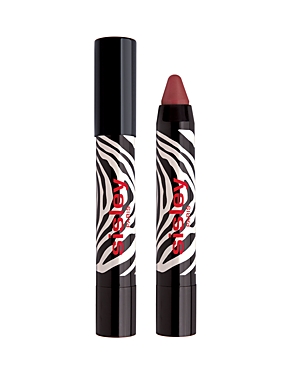 Red and black zebra-striped packaging with a twist-up lip crayon, featuring a pointed tip for precise application, labeled "Sisley Paris Phyto-Lip Twist."