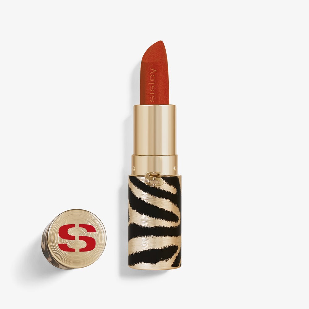 Red-orange lipstick with a smooth, velvety finish in a gold tube featuring a black and white zebra print design, topped with a gold cap embossed with the Sisley logo.