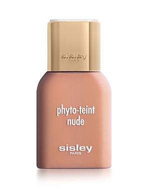 A sleek, beige bottle of Sisley-Paris Phyto Teint Nude foundation with a gold cap, featuring white text on the front.