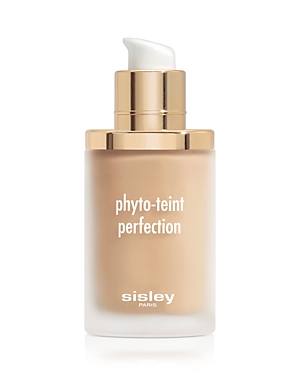 Glass foundation bottle with a gold pump and cap, featuring a frosted finish and white text reading "phyto-teint perfection" and "sisley" in a sleek design.