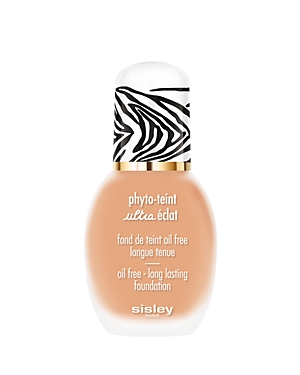 A beige foundation bottle with a zebra-striped cap and gold detailing, labeled "Phyto-Teint Ultra Éclat" and "oil free - long lasting foundation" by Sisley-Paris.