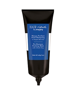 Black tube with a blue label, featuring "Hair Rituel by Sisley" and "Pre-Shampoo Purifying Mask with White Clay," designed for hair and scalp care.