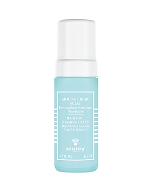 Light blue cylindrical bottle with a white pump top, labeled "Radiance Foaming Cream" by Sisley, featuring a clean design and a 125 ml capacity.