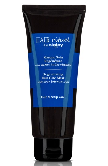 Black tube with a blue label, featuring the text "Hair Rituel by Sisley" and "Regenerating Hair Care Mask with four botanical oils," designed for hair and scalp care.