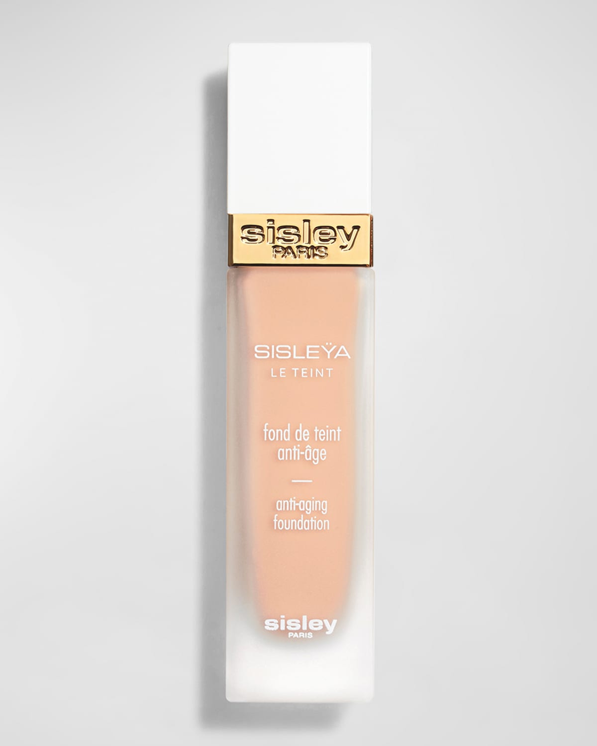 Sisley Sisleya Le Teint Anti Aging Foundation in shade #1C Petal, 30ml, features a sleek glass bottle with a white cap and gold accents, labeled with product details in elegant font.