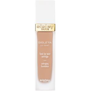 Sisley Sisleya Le Teint Anti Aging Foundation in #3R+ Pinky Peach, 30ml, features a sleek glass bottle with a gold cap and a soft peach-toned liquid foundation inside.