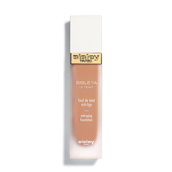 Sisley Sisleya Le Teint Anti Aging Foundation in shade #4R Spice, featuring a sleek glass bottle with a white cap and gold accents, labeled with product details.