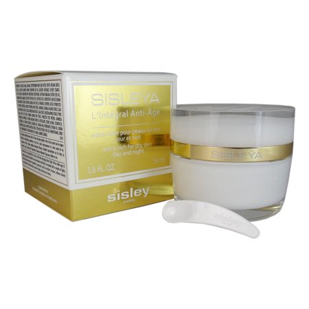 Luxurious white cream in a clear glass jar with gold accents, accompanied by a small white spatula, set against a gold and white box labeled "Sisley L'Integral Anti-Age."