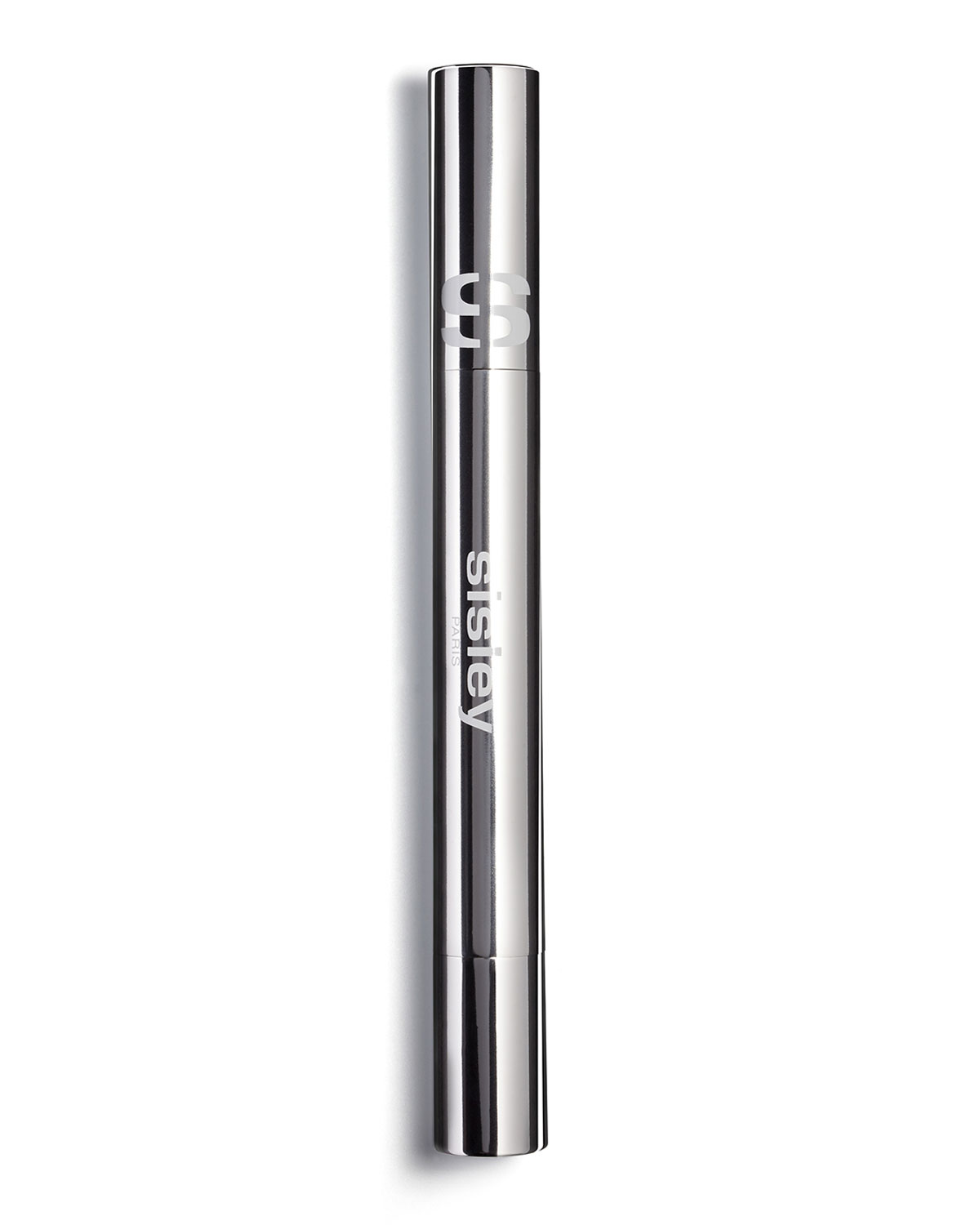 Sleek silver tube of "Stylo Lumiere" by Sisley, featuring a twist mechanism and a clear label, showcasing the shade "Warm Almond."