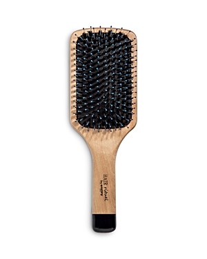 A rectangular paddle brush with a wooden handle, featuring black bristles and blue accents, designed for enhancing hair radiance.