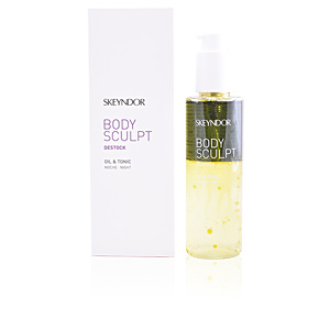 Clear glass bottle with a pump dispenser, containing a yellow body sculpt oil, alongside a white box featuring purple and black text, labeled "Skeyndor Body Sculpt Oil & Tonic (Night) - 150ml."