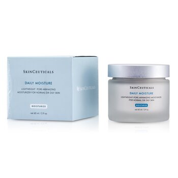 Light blue box beside a clear glass jar with a silver lid, labeled "Daily Moisture" for normal or oily skin, 60ml/2oz, featuring a minimalist design and elegant typography.