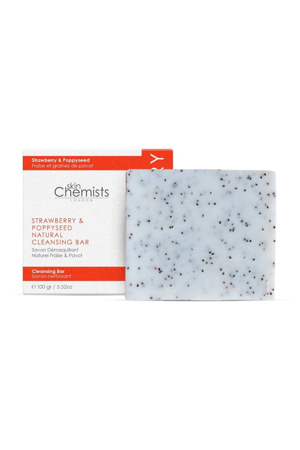 White cleansing bar with specks of black poppy seeds, packaged in a red and white box labeled "Skinchemists Professional Strawberry & Poppy Seed Cleansing Bar 100G."
