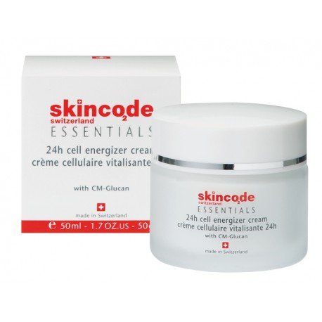 Skincode Essentials 24H Cell Energizer Cream in a frosted glass jar with a white lid, accompanied by a white box featuring red text and a Swiss flag emblem.