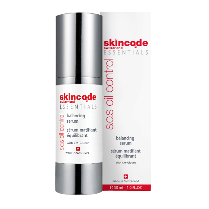 Skincode S.O.S Oil Control Balancing Serum in a sleek silver and white bottle, featuring a pump dispenser, with a label displaying the product name and details in red and black text.