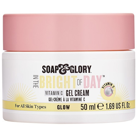 White jar with a pink lid, labeled "Soap & Glory Bright of Day Face Gel Cream," featuring Vitamin C and a 50ml capacity, designed for all skin types.