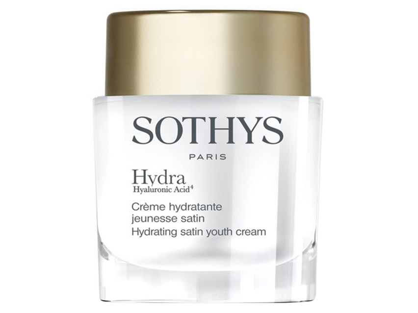 Sothys Hydrating Satin Youth Cream in a clear glass jar with a gold lid, featuring elegant black lettering and the brand name "Sothys" prominently displayed.