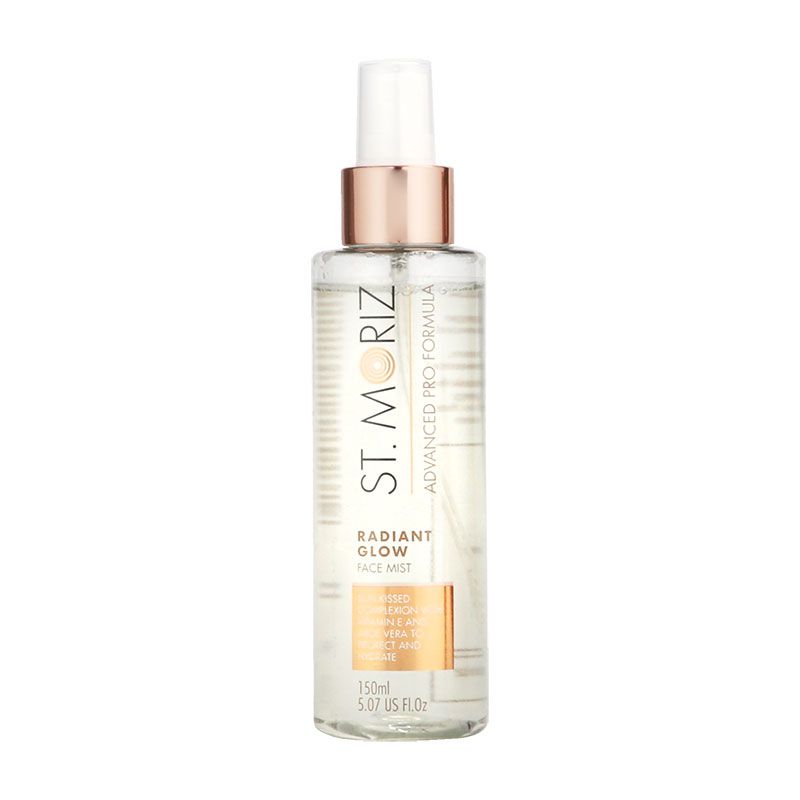 Clear spray bottle with a rose gold cap, labeled "St. Moriz Advanced Face Self-Tanner Medium 150ml," featuring a light golden liquid inside and a sleek design.