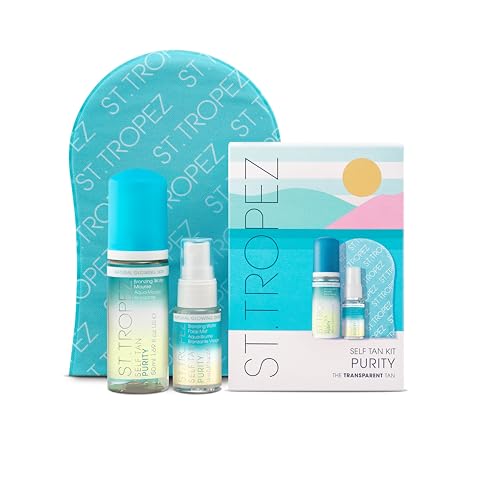 St. Tropez Purity Mini Kit featuring a turquoise tanning mitt, a blue spray bottle, and a clear serum, all packaged in a colorful box with a beach-themed design.