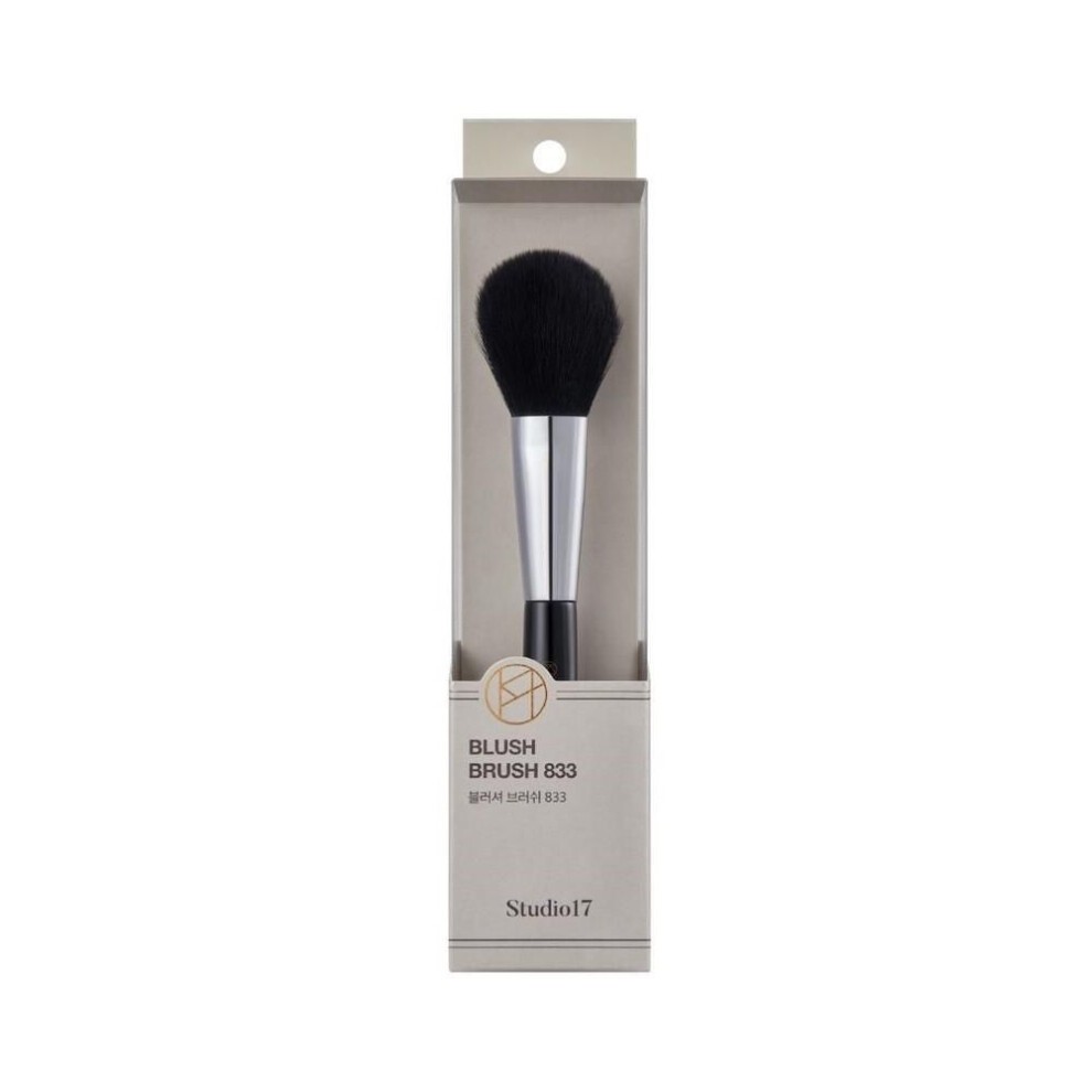 Black bristle blush brush with a silver ferrule and a black handle, packaged in a sleek, minimalist box featuring the Studio17 logo and product details.
