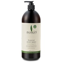 Dark brown plastic bottle with a black pump top, featuring a cream label that reads "Sukin Botanical Body Wash" in green and black text, 1L size.