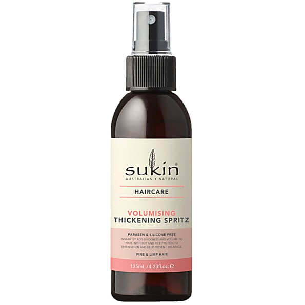Brown glass spray bottle with a black pump top, labeled "Sukin Volumising Thickening Spritz," features a pink and white design, suitable for fine and limp hair, 125ml.